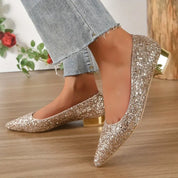 Ballerines Emilias à bout pointu pailletées pour femme, finition brillante adaptée aux tenues habillées.