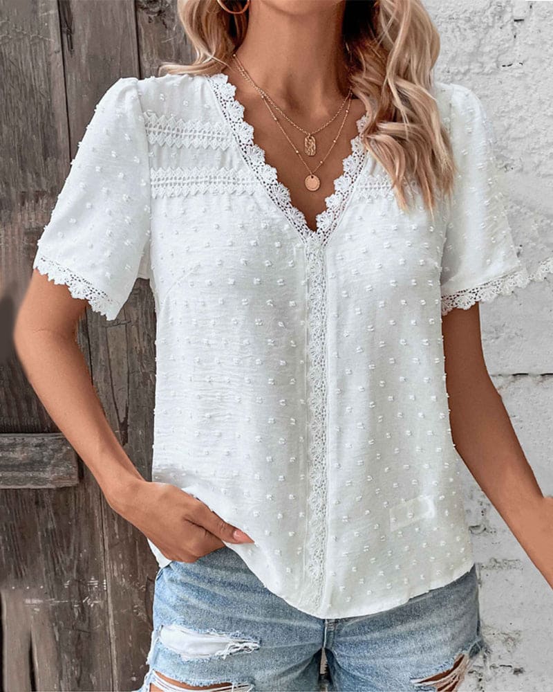 Top en dentelle blanche avec col en V et petits pois subtils pour femmes
