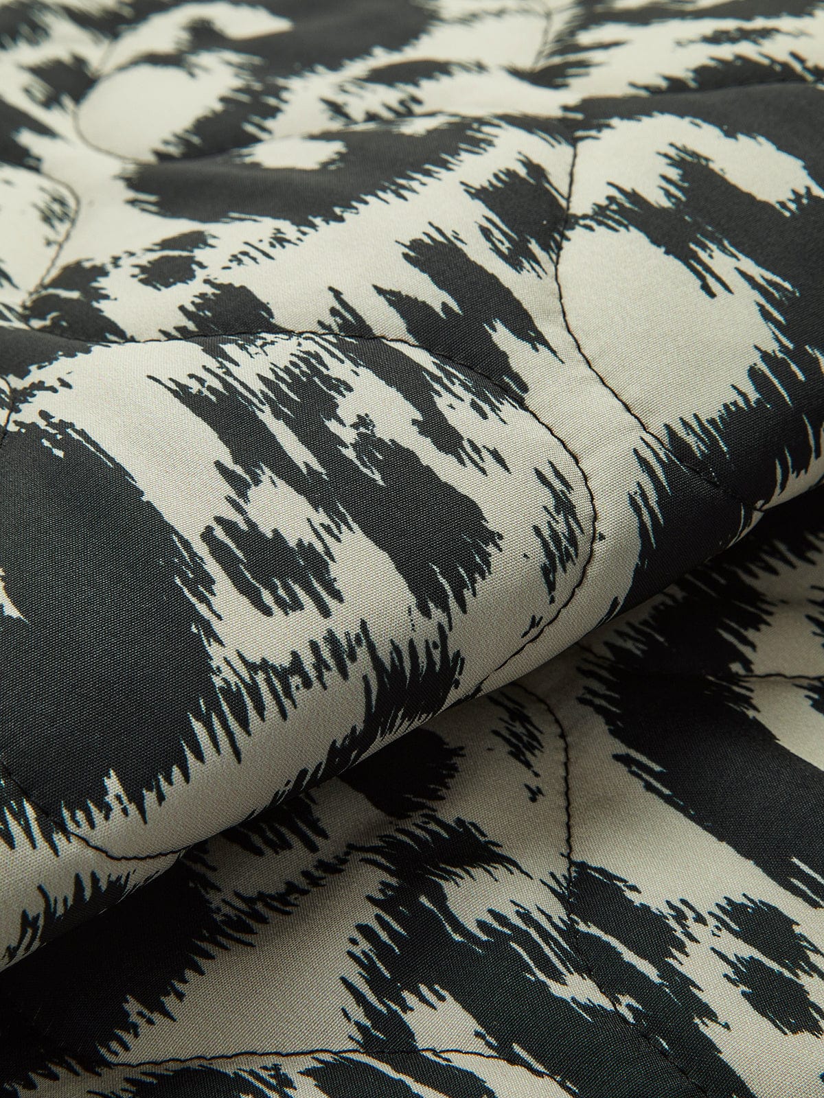Veste matelassée avec imprimé abstrait et fermeture à boutons-pression