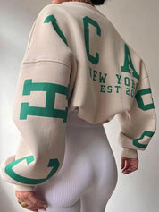 beige oversized sweatshirt met groene CHICAGO NEW YORK EST 2015 opdruk achterop