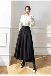 Elegante Maxi spódnica z wysokim stanem i głębokimi zakładkami