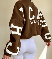 bruine oversized sweatshirt met zwarte CHICAGO NEW YORK opdruk op mouwen