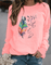 Sweatshirt Drinna hivernal pour femme avec détails plume, coupe confortable et doublure douce adaptée aux journées froides.