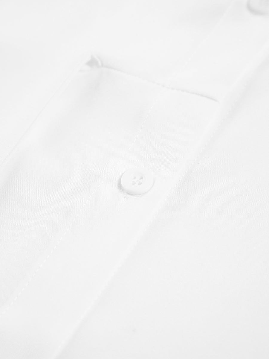 Długa bluzka damska z guzikiem w talii i długimi rękawami